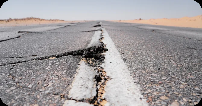 A cracked road awaiting repair